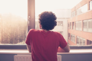 kid looking out the window has purple drank addiction