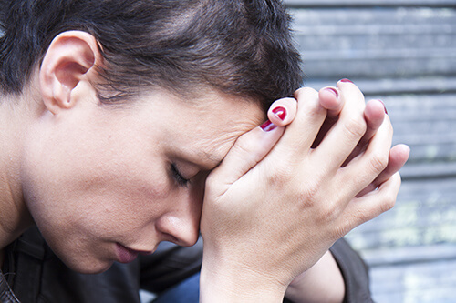 woman with head on your hands has tramadol addiction