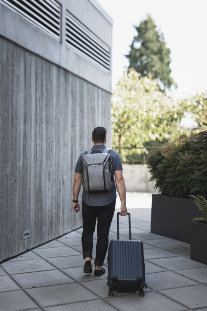 man leaving with bag